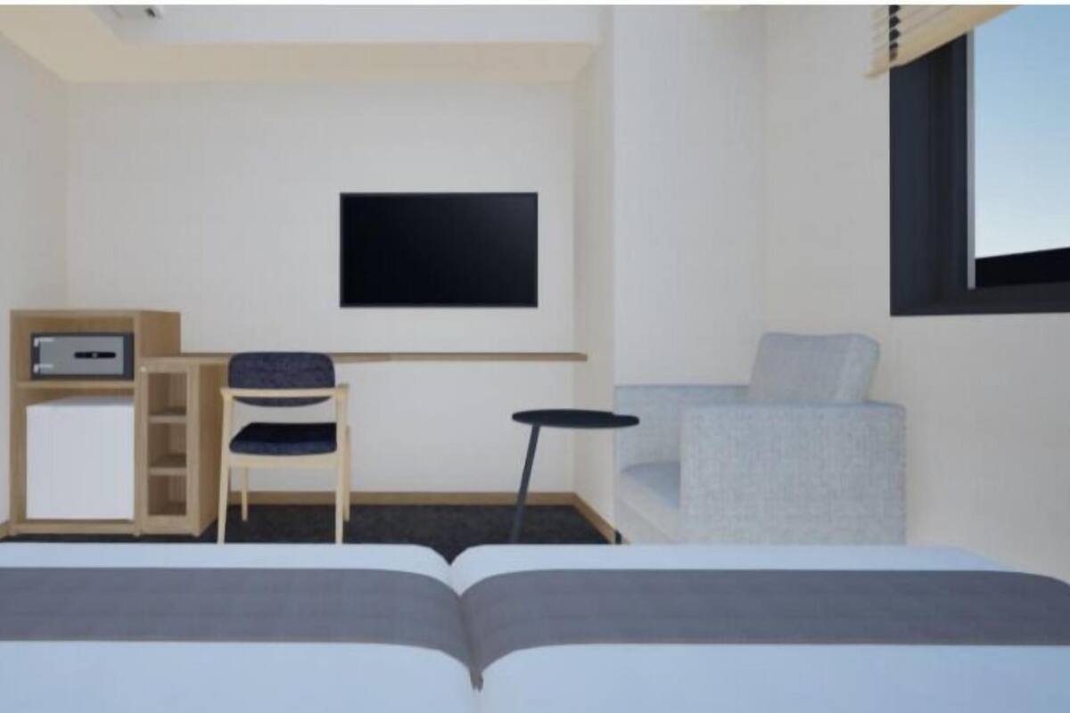 Habitación estándar con 2 camas individuales, 2 camas matrimoniales | Caja de seguridad en la habitación y wifi gratis