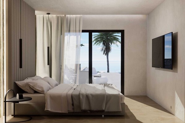 A modern bedroom with a bed, a small table, a TV, and a view of the ocean.
