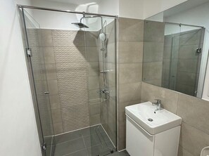 Shower, towels, soap, toilet paper