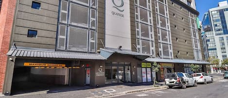 A building with a large sign reading 'QUAYSIDE' and a 'MAXIMUM HEIGHT 2m' sign.