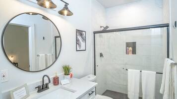 Shower, hair dryer, towels, shampoo