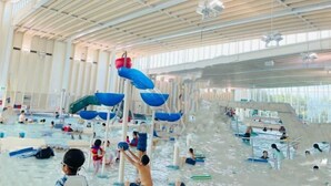 An indoor water park with multiple water slides and pools. - Vancouver Love Home Luxury Inn (Richmond)