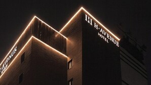 A building with illuminated signage reading "H.H. AVENUE HOTEL." - H Avenue Hotel Jeonju Terminal (Jeonju)