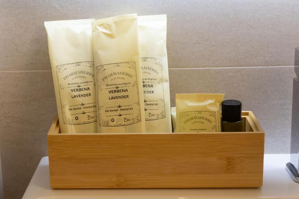 A wooden box containing three bottles of Verbena Lavender dental kit and a smaller bottle of Verbena Lavender.