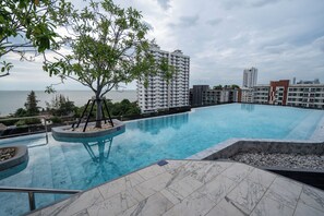 Outdoor pool, pool umbrellas, pool loungers