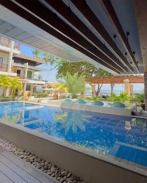 3 outdoor pools, open 8:00 AM to 8:00 PM, pool umbrellas, pool loungers