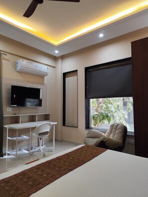 Estudio, vista a la ciudad | Área de sala de estar