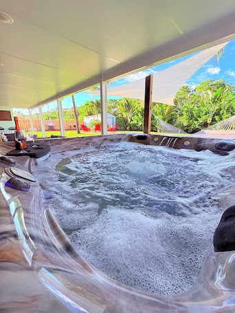 Indoor spa tub. Palm Paradise • Jacuzzi • Hammock • Game Yard