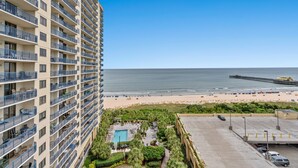 A high-rise hotel with multiple balconies overlooking a beach and ocean. - Brighton 1410 3 Br Oceanfront in Kingston w/Pool (Myrtle Beach)