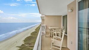 A balcony with a view of the beach and ocean. - Crescent Shores 1308 Oceanfront, Pools, Lazy River (North Myrtle Beach)
