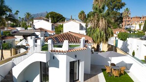 A modern villa with a rooftop terrace, a swimming pool, and a view of the surrounding neighborhood. - Linda Vista Beach Apartment (Marbella)