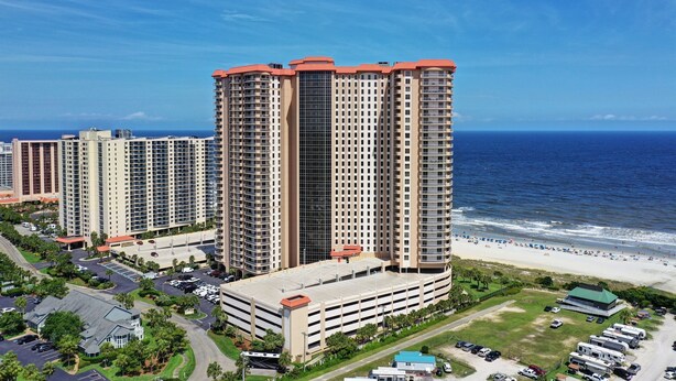 A high-rise hotel with multiple floors, a parking garage, and a beach view. - Margate 2109 in Kingston, Oceanview, Pool, Beach (Myrtle Beach)