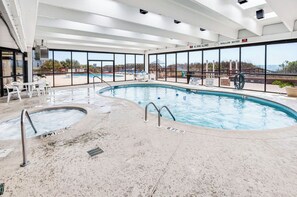 An indoor swimming pool with clear views of the beach and ocean through large windows. - WaterPointe II #905-Oceanfront Treasure-Pools,Gym (North Myrtle Beach)