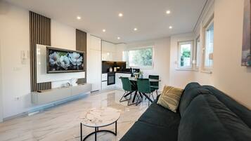 Deluxe Apartment, 2 Bedrooms, 2 Bathrooms, Pool View | Living area | TV