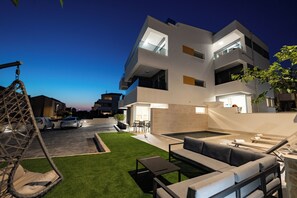 Front of property - evening/night - Relax apartments with private pool (Novalja)