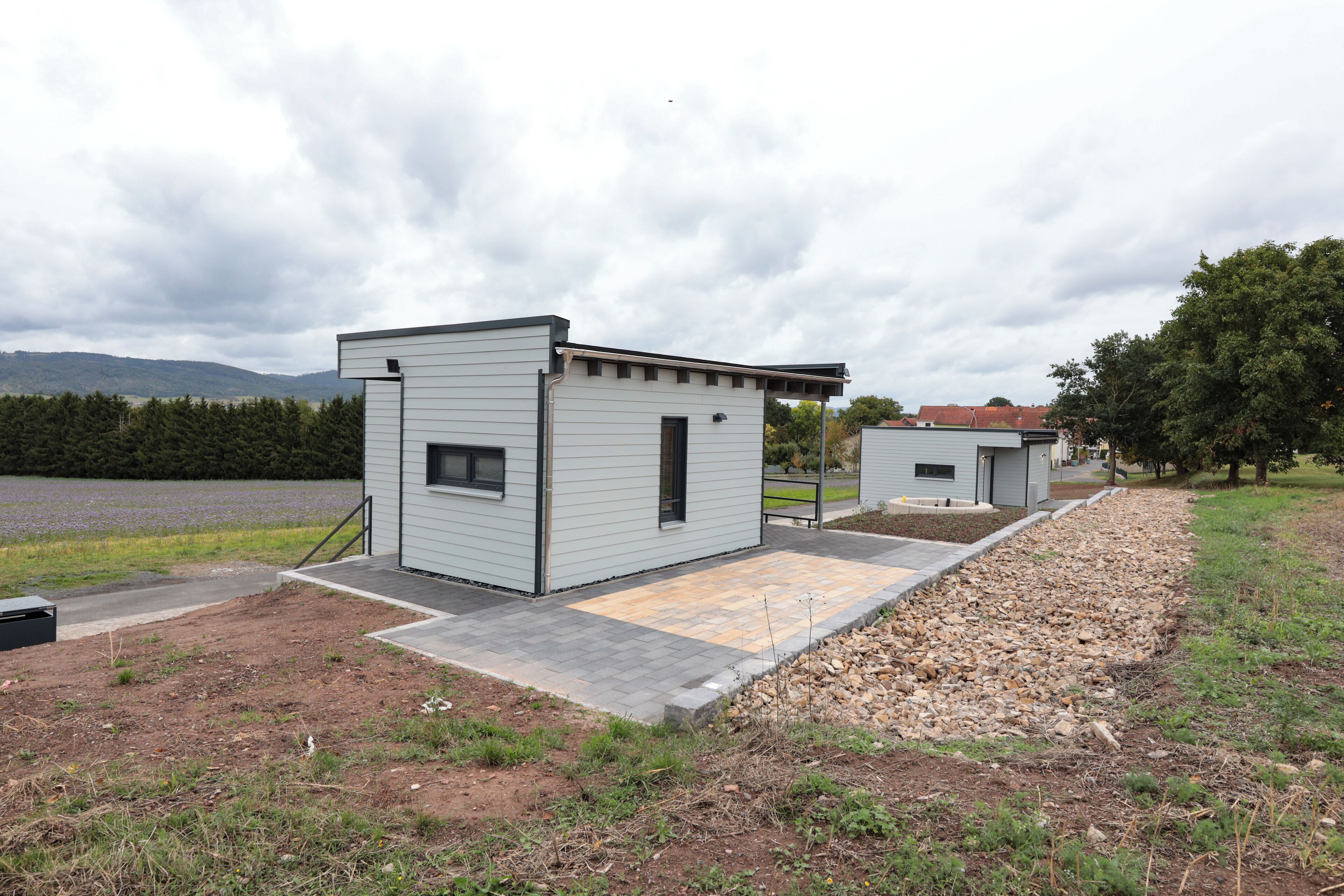 A modern building with a flat roof and a small window.