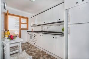 Microwave, coffee/tea maker, high chair, cookware/dishes/utensils