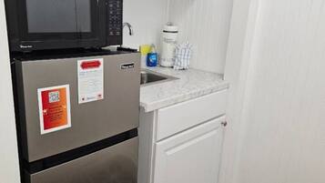 Microwave, coffee/tea maker, toaster, cookware/dishes/utensils