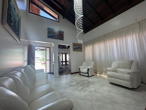 Deluxe House, Pool Access, Pool View | Living area | 65-inch Smart TV with digital channels, Netflix, pay movies