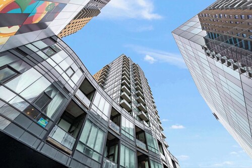 Modern High Rise Condo w Private Patio—Downtown