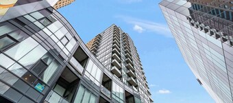 Modern High Rise Condo w Private Patio—Downtown