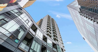 Modern High Rise Condo w Private Patio—Downtown