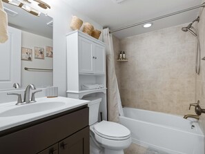 Shower, hair dryer, towels, shampoo