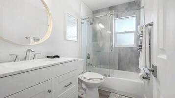 Shower, hair dryer, towels
