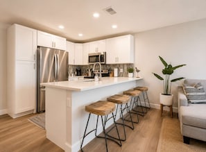 Coffee/tea maker, fridge, microwave, oven