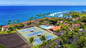 An aerial view of a coastal resort with multiple tennis courts, a swimming pool, and a view of the ocean. - Kksr#6301 Ocean/Golf Course Views, Top Floor, Corner Unit, Cathedral Ceilings (Kailua Kona)