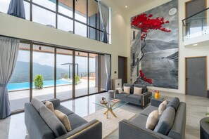 TV, fireplace - 5BHK Green Atlas Villa with Infinity Pool, Turf, Games and Theatre (Mahagaon)