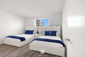 1 bedroom, desk, iron/ironing board, travel crib