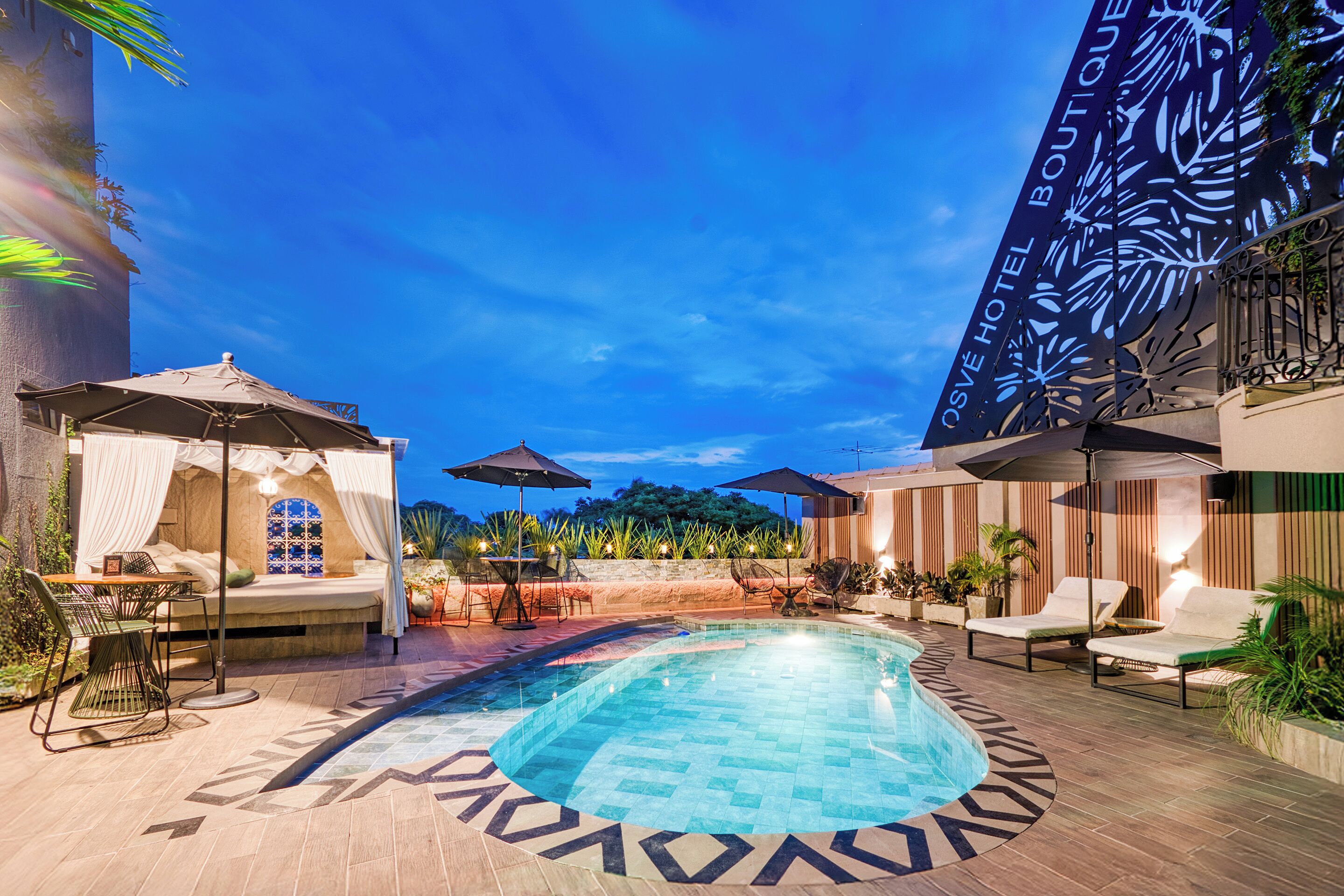 Outdoor pool, open 10:00 AM to 8:00 PM, pool umbrellas, pool loungers