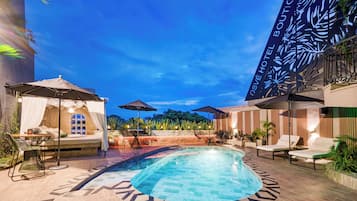 Outdoor pool, open 10:00 AM to 8:00 PM, pool umbrellas, pool loungers
