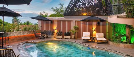 Outdoor pool, open 10:00 AM to 8:00 PM, pool umbrellas, pool loungers