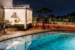 Outdoor pool, open 10:00 AM to 8:00 PM, pool umbrellas, pool loungers