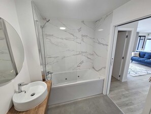 Jetted bath, hair dryer, bidet, towels