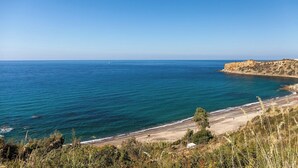 A coastal landscape with a beach, rocky cliffs, and clear blue sea. - Casa Romito - Four Bedroom Villa, Sleeps 8 (Cefalù)