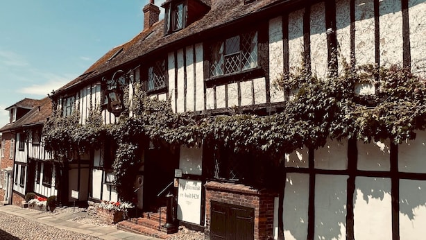 A traditional Tudor-style building with a stone-paved street in front. - Easter Cottage - Central Rye, Effortless Chic! | Pass the Keys (Rye)