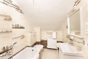 Shower, hair dryer, towels, toilet paper