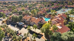 A residential area with houses, a swimming pool, and a parking lot. - STUNNING Views, SUBERB Location..NEW NEW NEW to The Racquet Club in Scottsdale! (Scottsdale)