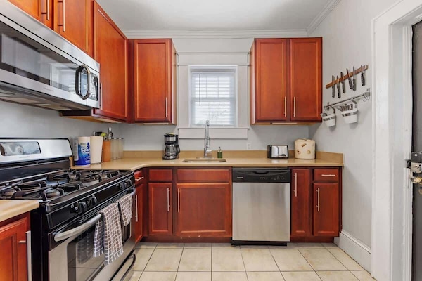 This bright kitchen features modern appliances and ample space, making it easy to prepare meals during your stay.
