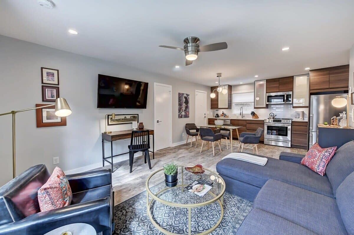 Sun-drenched living area featuring a large Smart TV and free Wi-Fi for your favorite streaming apps.