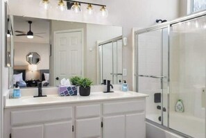 Hair dryer, towels, shampoo, toilet paper