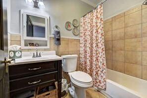 Shower, hair dryer, towels, shampoo