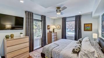 1 bedroom, desk, iron/ironing board, travel crib