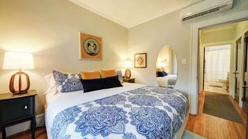 1 bedroom, desk, iron/ironing board, travel crib