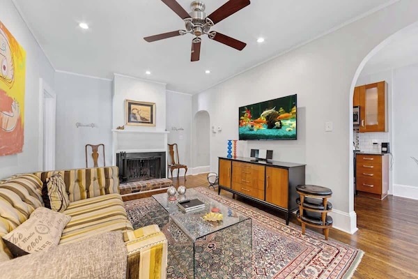 Bright, open living space with natural light, Smart TV, and free Wi-Fi just minutes from Uptown Charlotte.