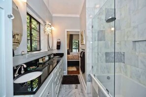 Shower, hair dryer, towels, shampoo