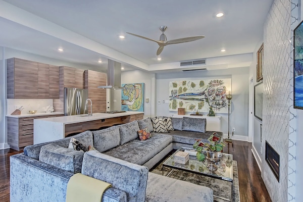 Bright, open living space with natural light, Smart TV, and free Wi-Fi just minutes from Uptown Charlotte.